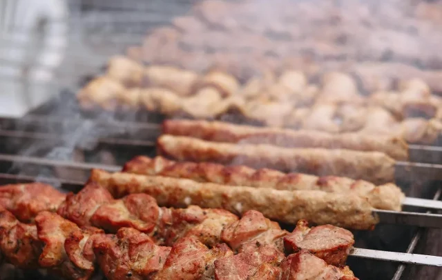 kebabs cooking over grill